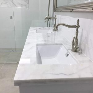 White Marble Vanity with undermount sink cutouts
